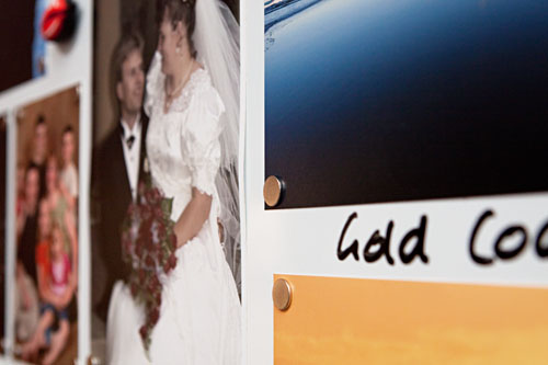 small magnets in each corner of the photos