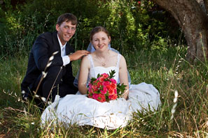 bride and groom in the grass