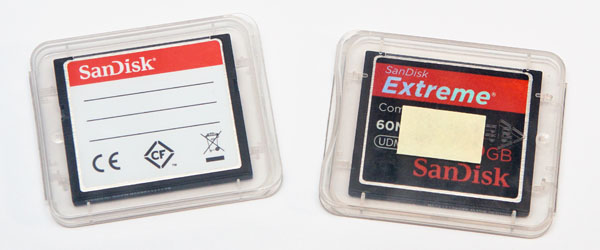 two full memory cards in their cases (front of memory cards facing TOWARDS from the label)