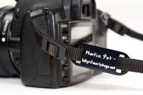 a slide-on tag on the strap of my Canon 350D