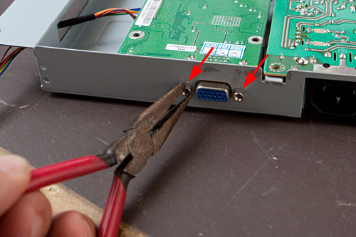 figure 9: remove the lugs holding the VGA connector in place