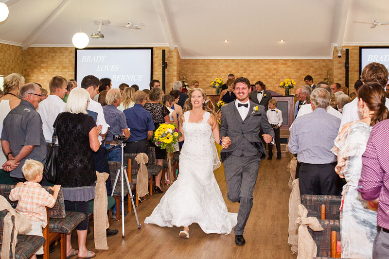 bridal couple running out of church