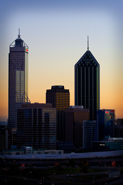 dawn behind Perth city buildings
