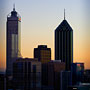 dawn behind Perth city buildings