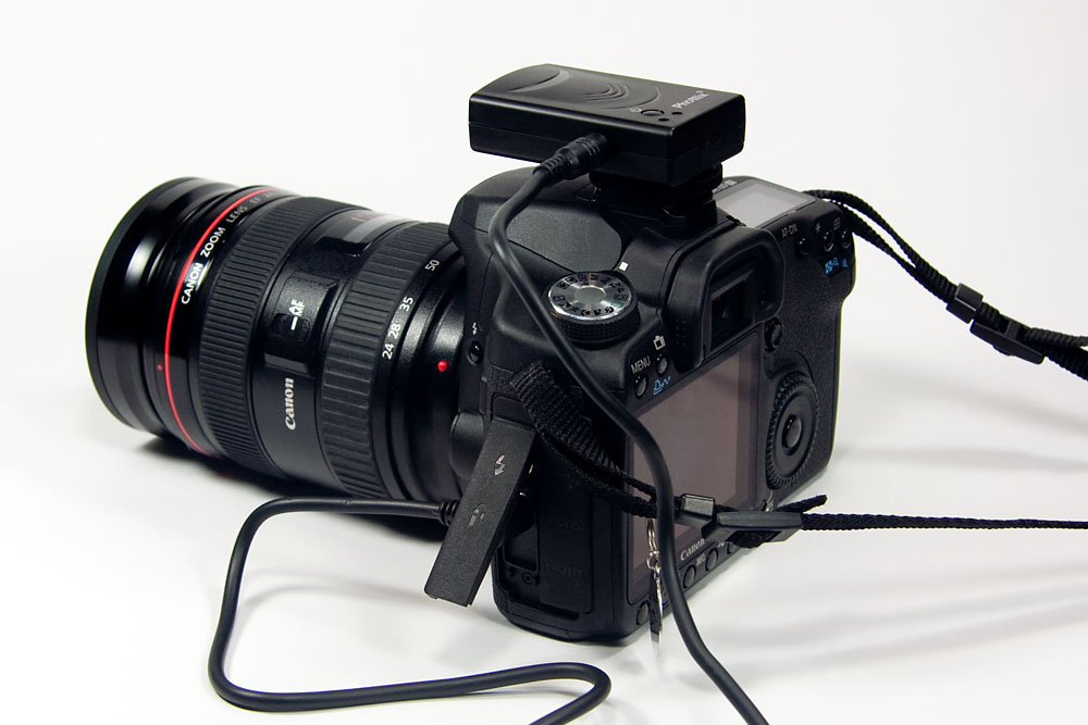receiver mounted on the hotshoe of a Canon 50D for wireless operation