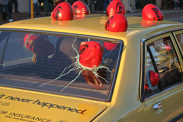 Footballs vs car