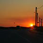 Kite-surfer and powerlines at sunset