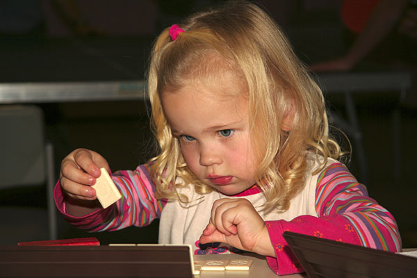Kira concentrating on Rummikub
