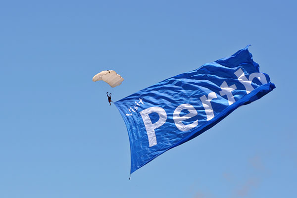 parachutist with a giant flag
