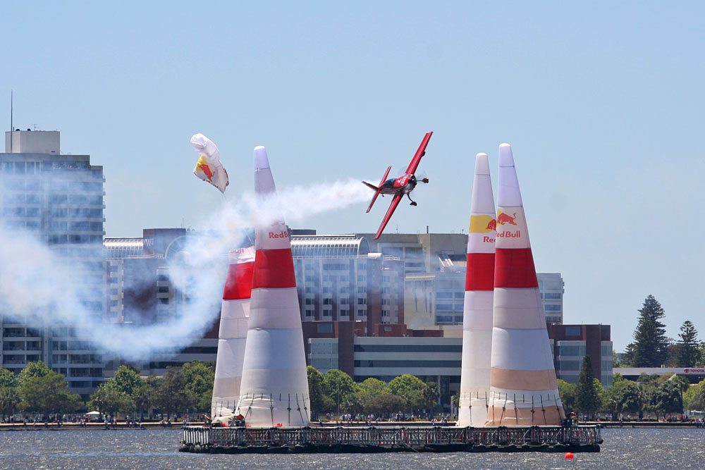 A plane hits the top of a pylon