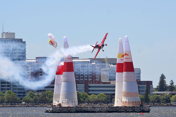 A plane hits the top of a pylon