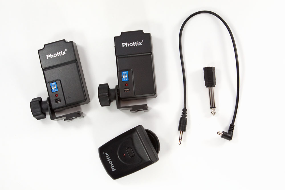 Tetra components: 2 receivers, one transmitter, sync cable, and adaptor