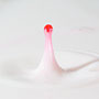 red water dropping into milk