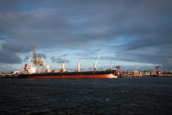 a ship being loaded with scrap metal