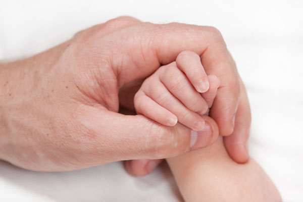 comparing Zoes hand to her dads hand