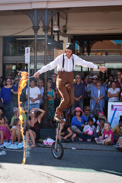 a tall unicycle and a burning whip....what could possibly go wrong?
