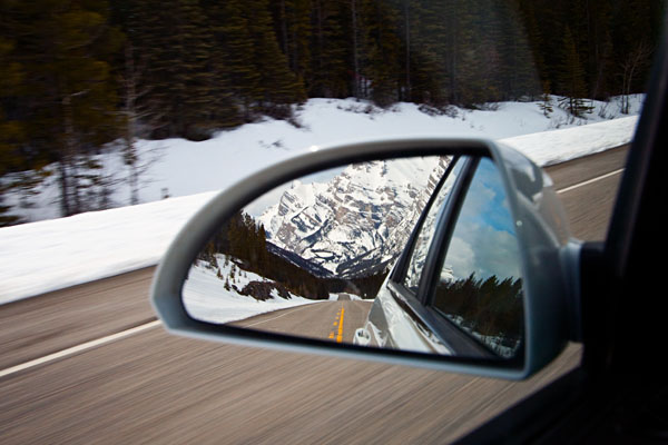 snow-covered mountains in the mirror