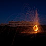 steel wool spinning in front of the old Fremantle Power Station