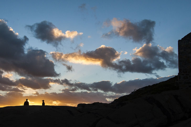 boys silhouetted in the sunset