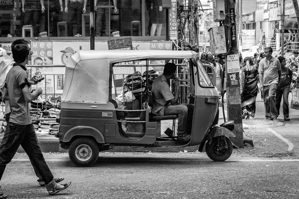 auto rickshaw driver waiting for passengers