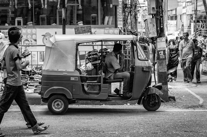 auto rickshaw driver waiting for passengers