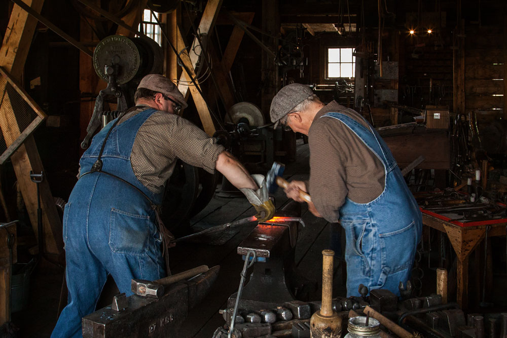 blacksmith and striker working together