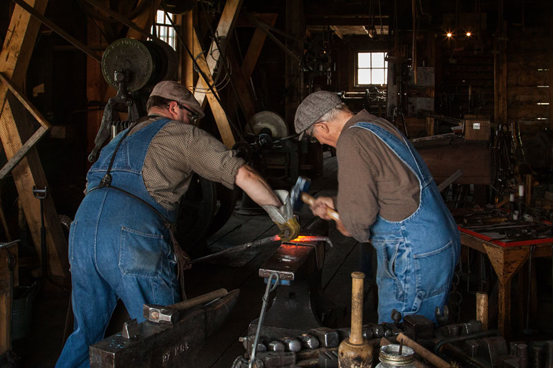 blacksmith and striker working together