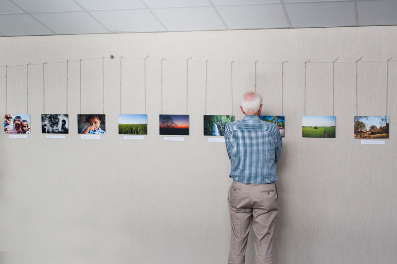 a visitor viewing the photos