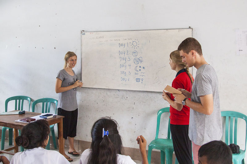 Tenieka, Michelle and Ashley teaching the creation story at Elpida School