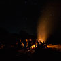 sitting around the bonfire at the beach