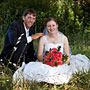bride and groom in the grass