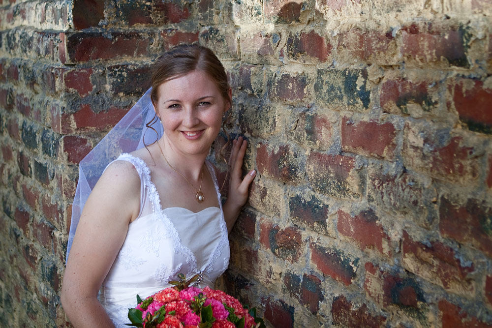 bride and brick wall